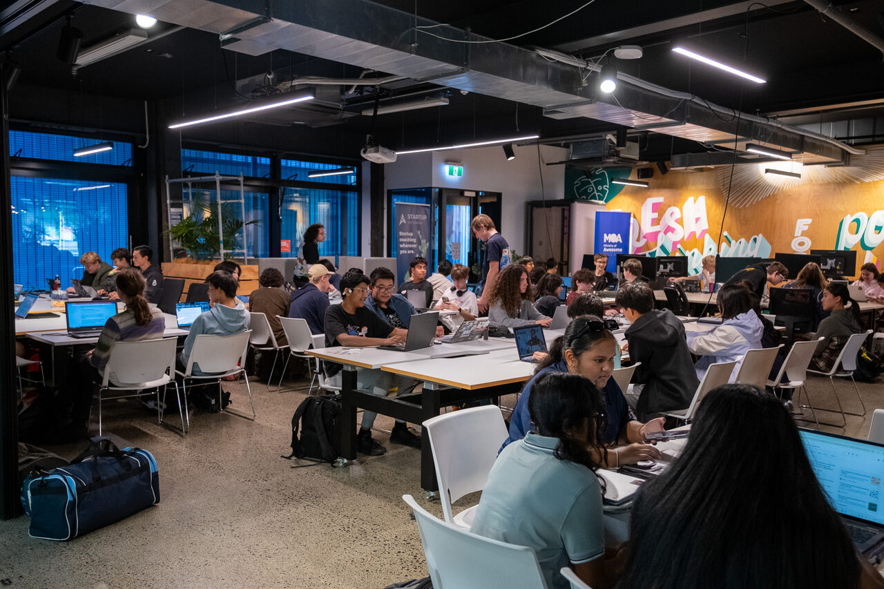 High schoolers deep in a project at KiwiHacks