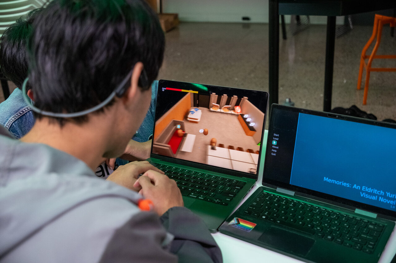 Students working together at a KiwiHacks event